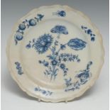 A Worcester shaped circular dish, decorated with wild flowers and insects, 17.5cm diam, c.1770