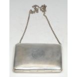 A George V silver rounded rectangular visiting card case, engine turned and centred by a vacant