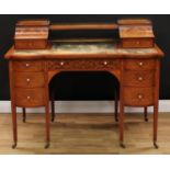 A late Victorian Sheraton Revival mahogany and marquetry writing desk, shaped superstructure with