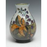 A Moorcroft Blackberry pattern baluster vase, 19.5cm high, impressed marks, monogrammed WM in green,