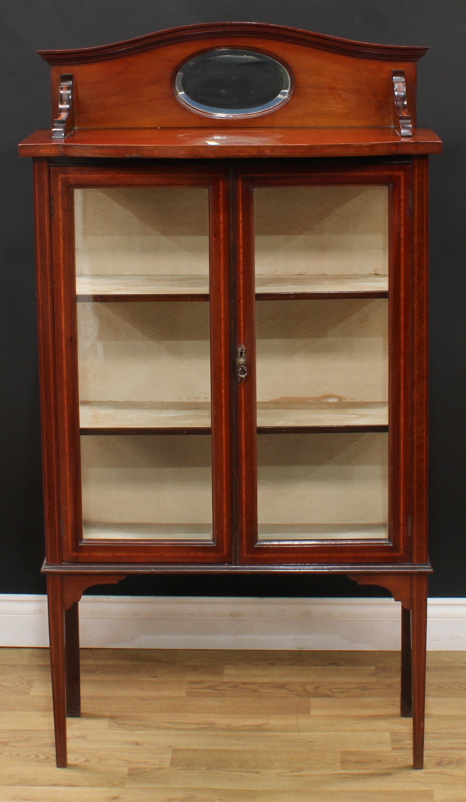 An Edwardian mahogany display cabinet, serpentine arched cresting with bevelled oval mirror, bow - Image 2 of 4