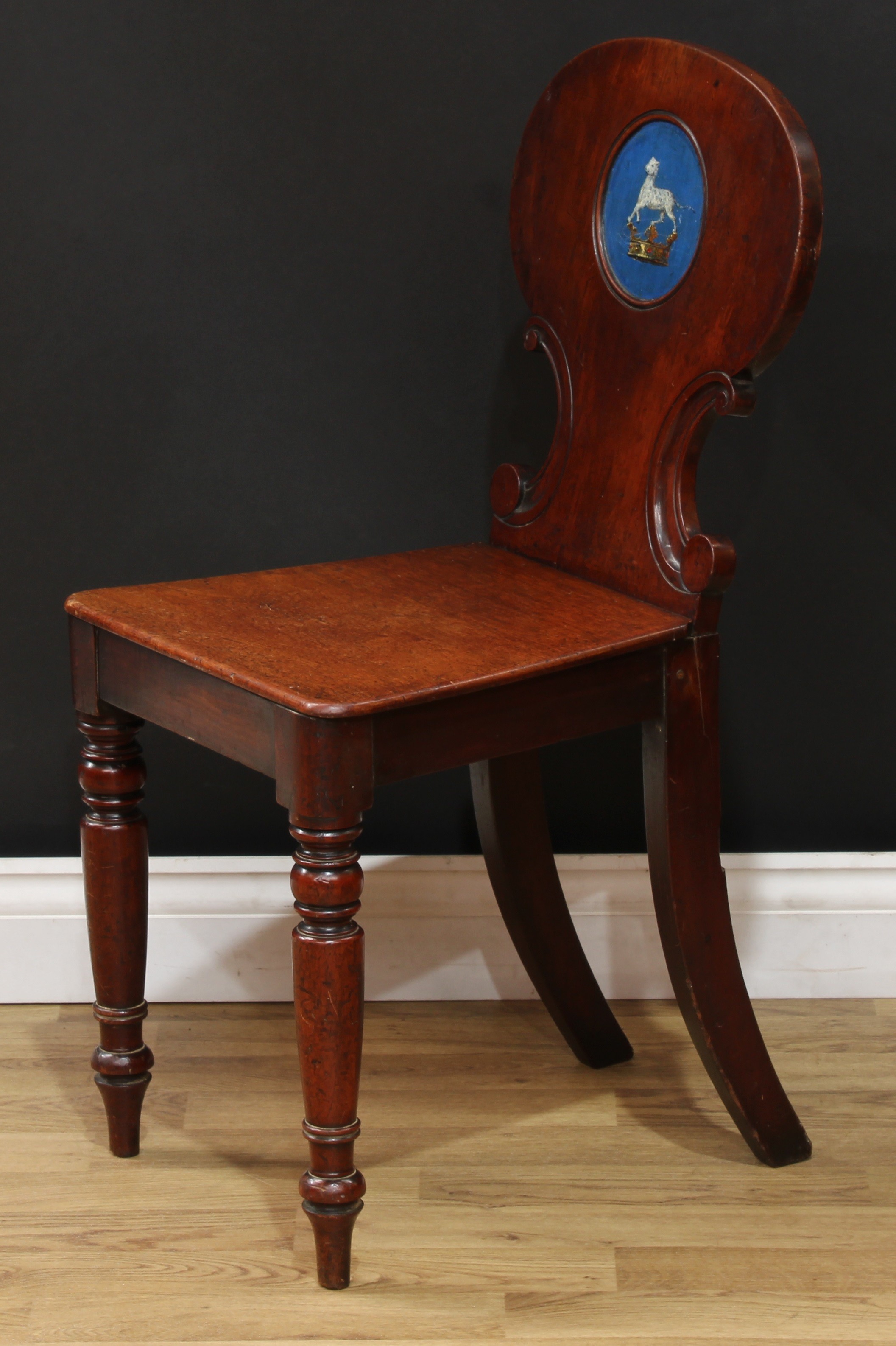 A Victorian mahogany heraldic hall chair, shaped back carved with C-scrolls and polychrome painted - Image 4 of 5