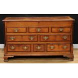 A George III mahogany crossbanded oak Lancashire chest, hinged rectangular top with moulded edge