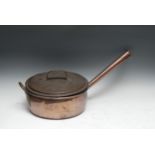 A 19th century copper kitchen pan and cover, of country house proportion, loop handle, 34cm diam, c.