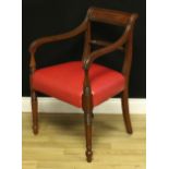 A George IV mahogany desk chair, curved rectangular cresting rail, rope-twist mid rail, reeded