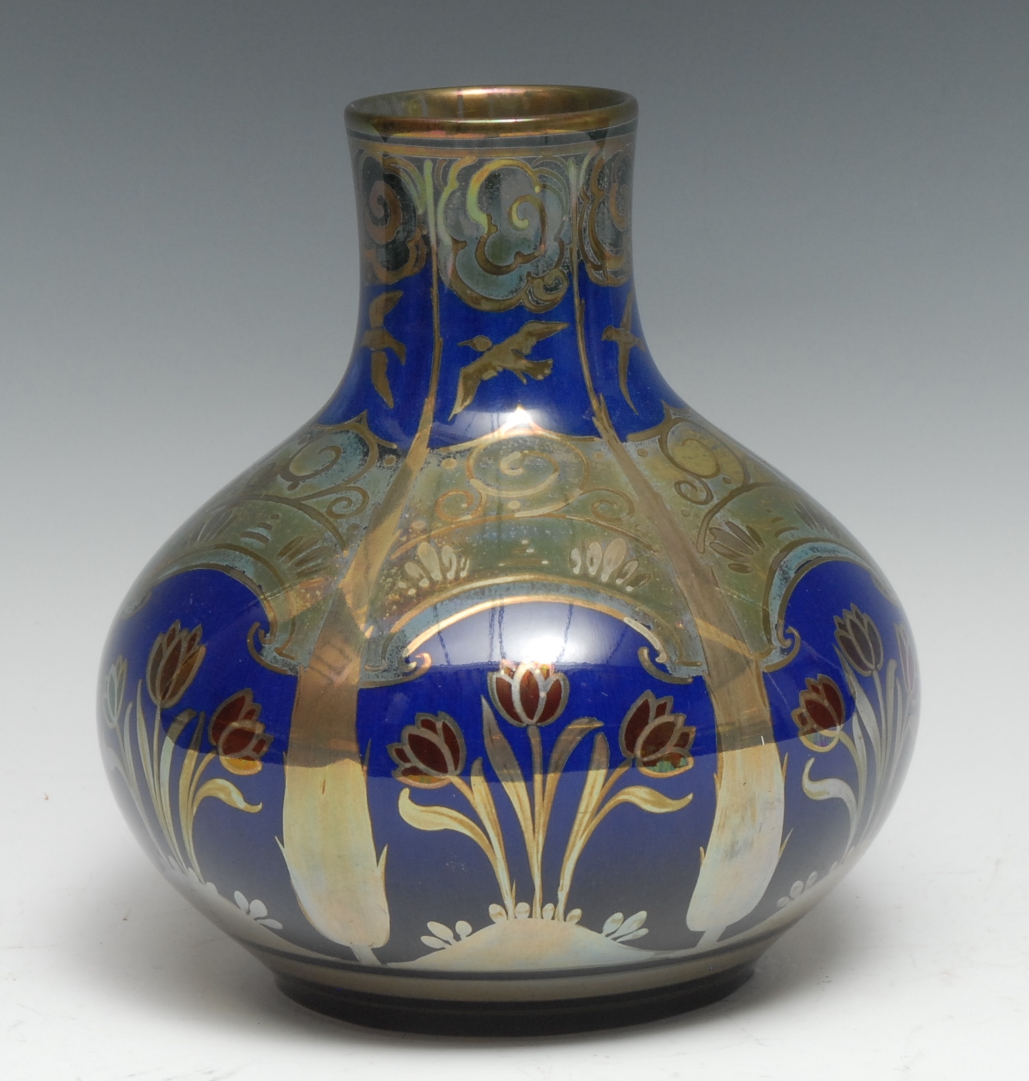A Pilkingtons Royal Lancastrian bottle vase, designed by William S Mycock, with stylised tulips
