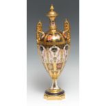 A Royal Crown Derby 1128 pattern pedestal ovoid vase and cover, spire finial, elaborate scroll