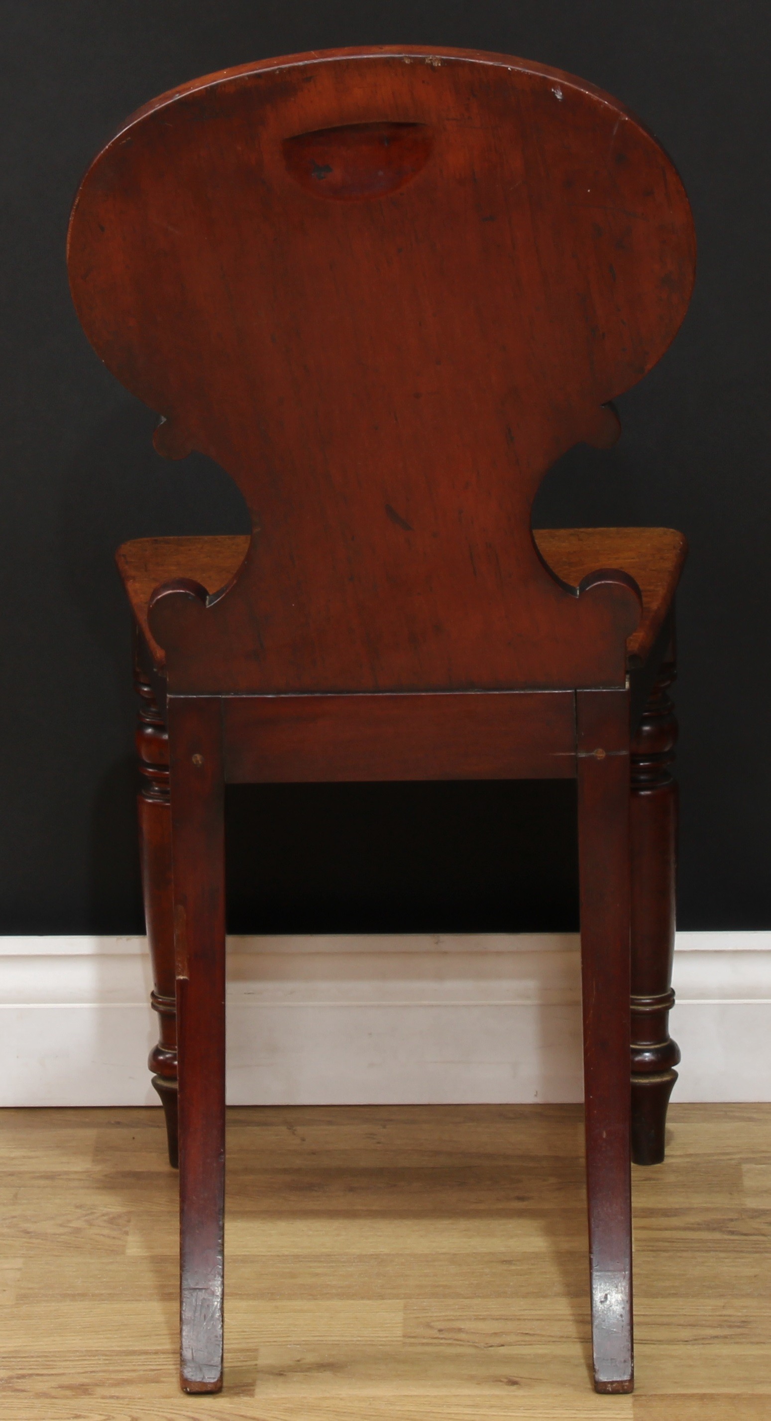 A Victorian mahogany heraldic hall chair, shaped back carved with C-scrolls and polychrome painted - Image 5 of 5