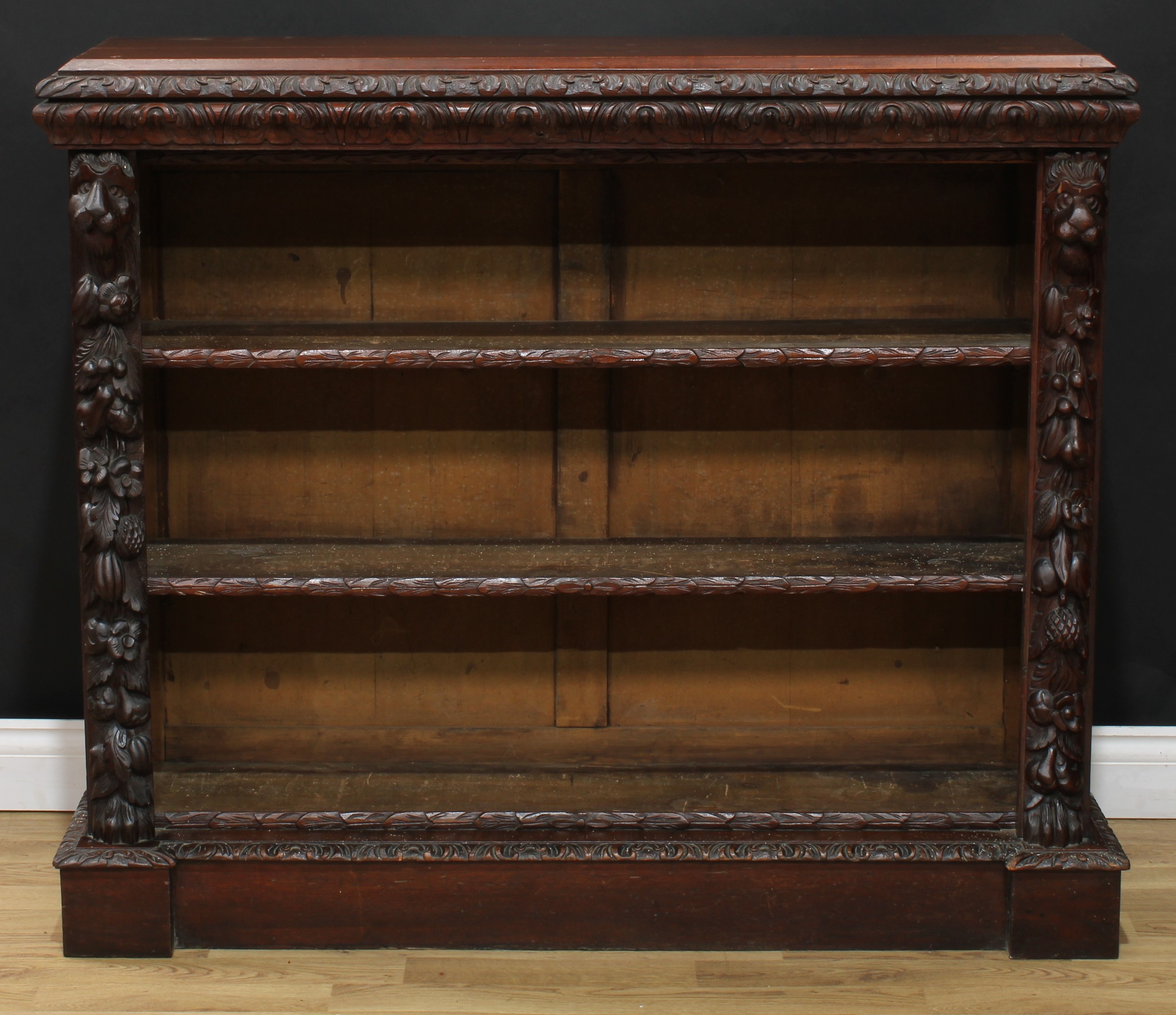 A late Victorian oak library open bookcase, rectangular top with leafy moulded edge above two - Image 2 of 5