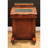 A Victorian walnut Davenport desk, hinged concave rectangular superstructure with three-quarter