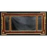 A 19th century parcel-gilt mahogany shaped rectangular three-plate looking glass, the frame bordered