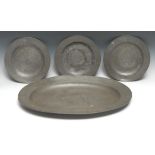 A suite of 19th century Scottish country house pewter plates, comprising an oval meat dish and three