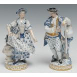 A Pair of Meissen figures, The Gardener and The Flower Lady, each decorated in blue and gilt, he