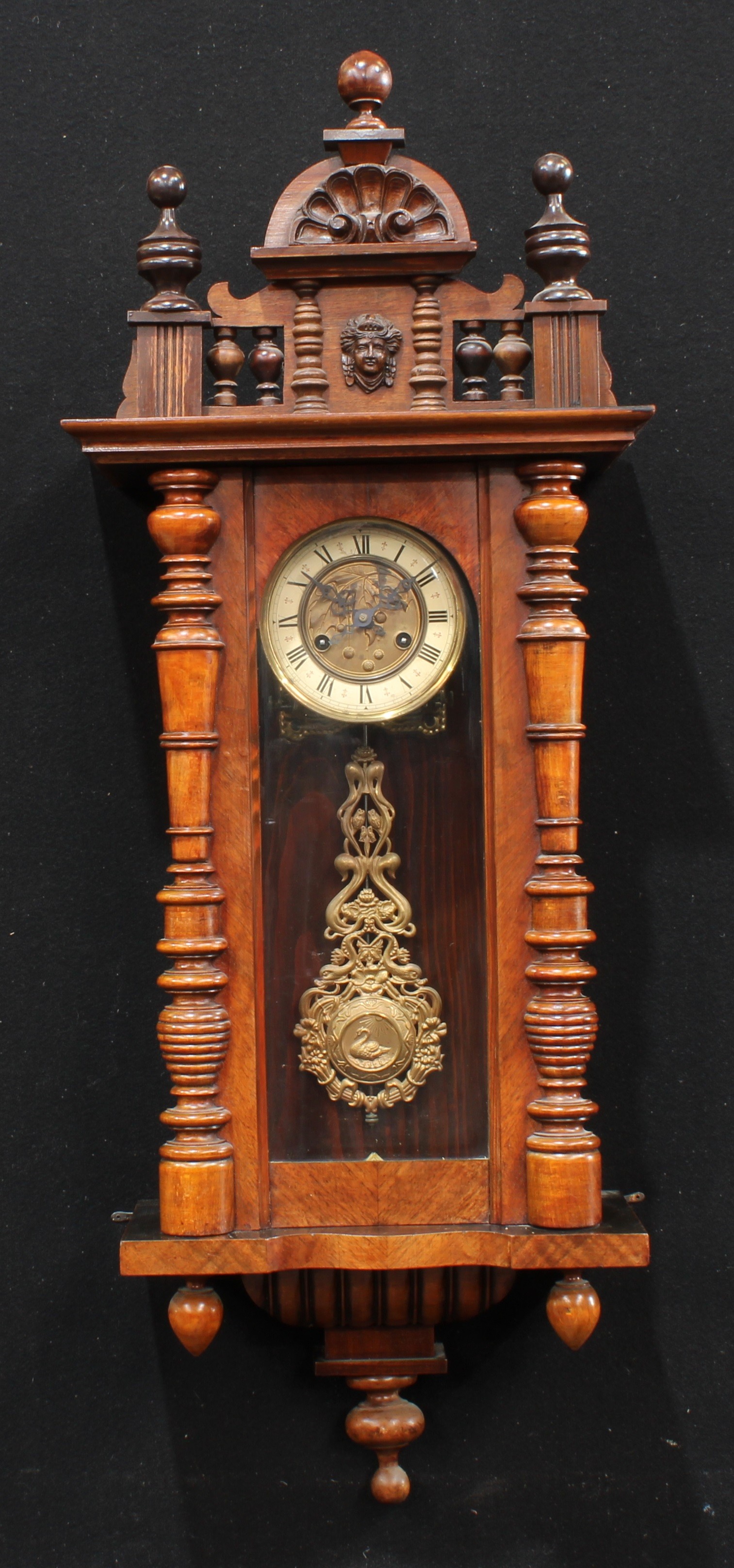 A 19th century walnut Vienna wall clock, 13cm enamel dial inscribed with Roman numerals, twin