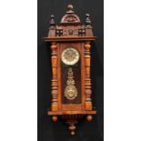 A 19th century walnut Vienna wall clock, 13cm enamel dial inscribed with Roman numerals, twin