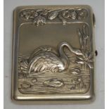 A Russian silver-gilt rounded rectangular cigarette case, the hinged cover in relief with a swan