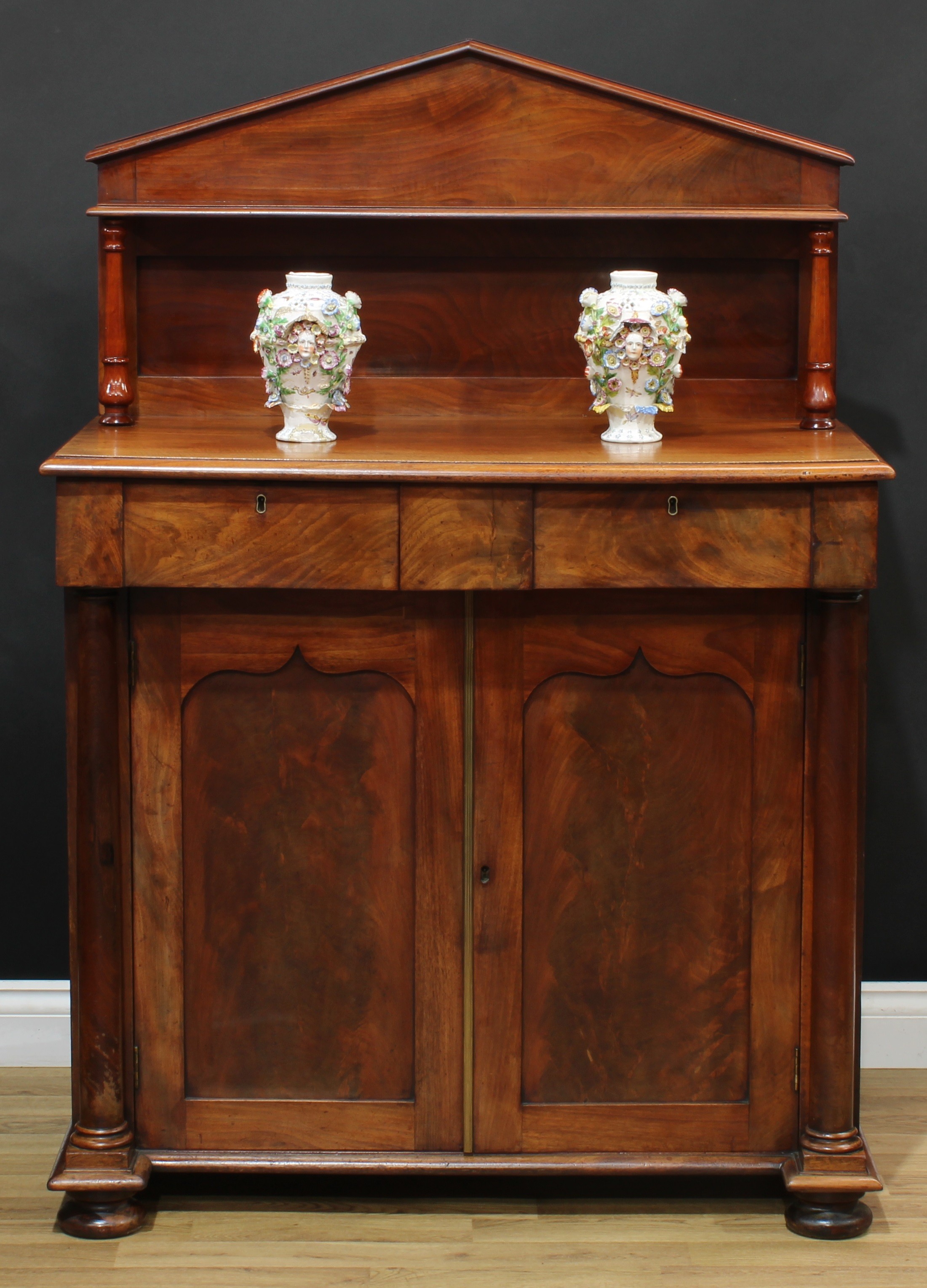 A William IV mahogany chiffonier, pointed-arch superstructure with small bookcase shelf, turned