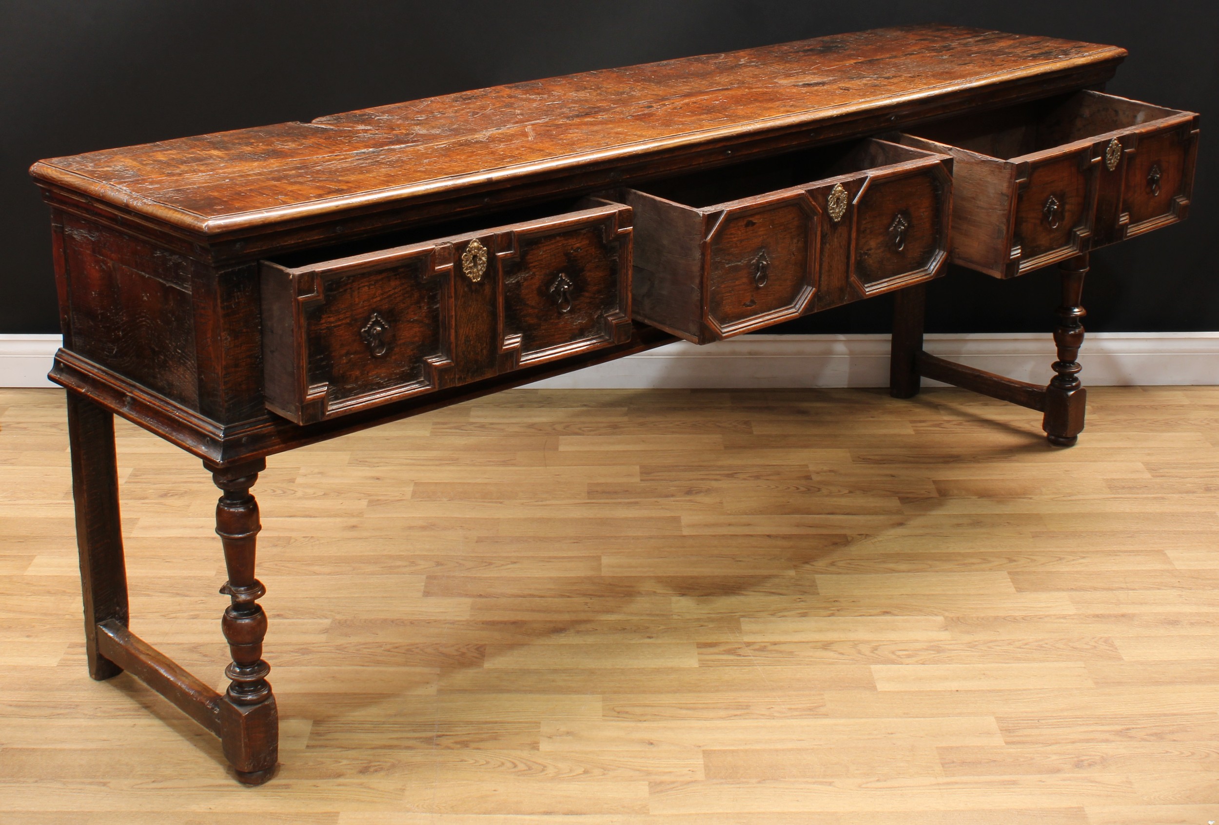 A Charles II design oak block front low dresser, oversailing plank top with moulded edge above three - Image 4 of 6