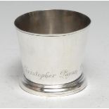 An early George II silver flared cylindrical beaker, of small proportions, skirted base, 5cm high,