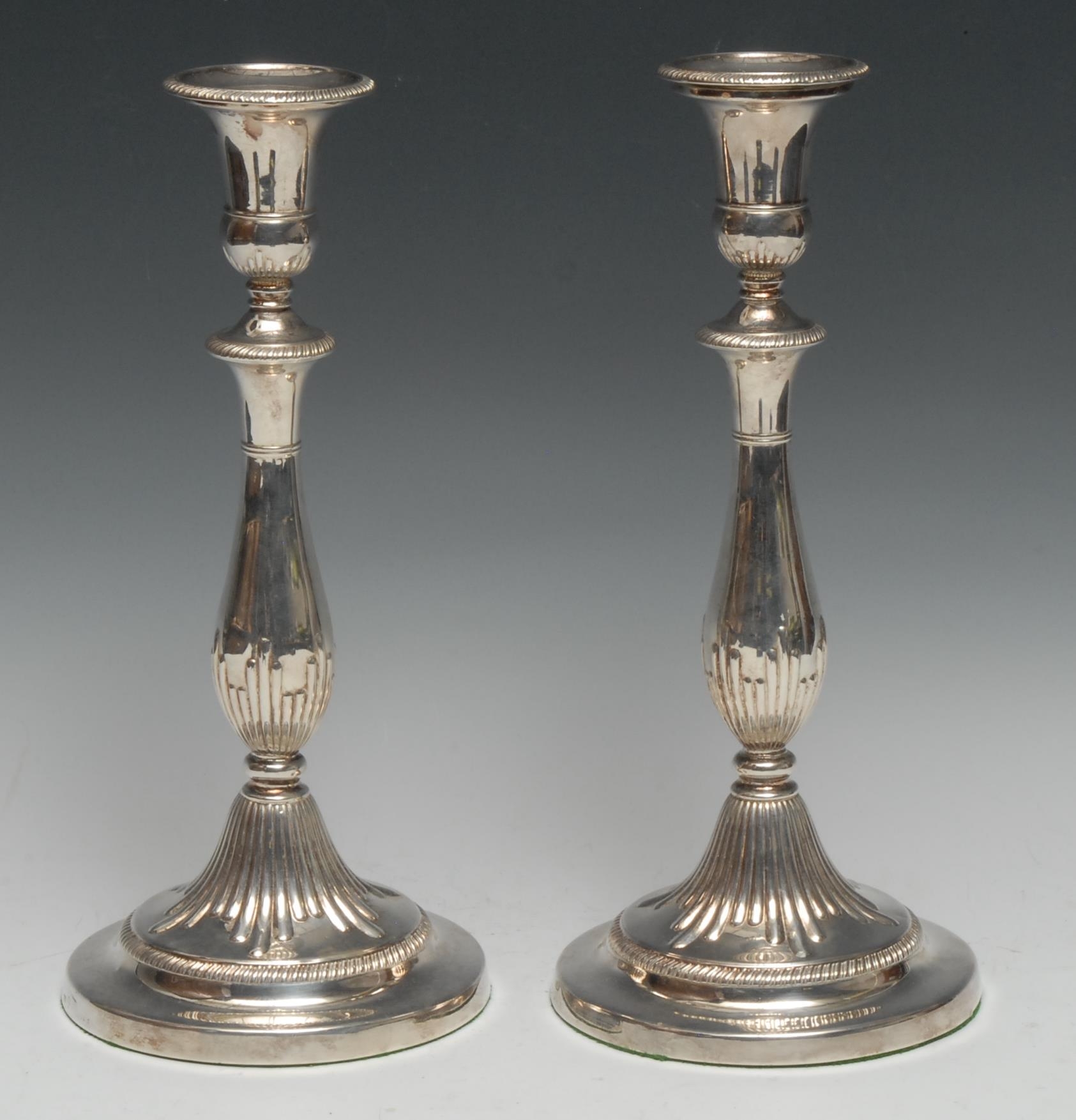 Matthew Boulton - a pair of George III silver table candlesticks, campana sconces with detachable