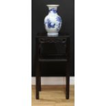 A Chinese hardwood side table or jardiniere stand, rectangular panel top above a shaped and