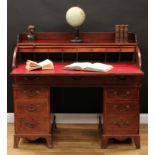 A George III mahogany tambour front twin pedestal desk, three quarter gallery and retractable