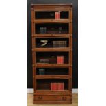 An early 20th century oak modular stacking barrister or solicitor library bookcase, by The Globe