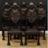 A set of five South European parcel-gilt dining chairs, each back carved with a Habsburg double-
