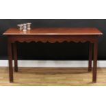 A George III mahogany serving table, rectangular top with moulded edge, shaped apron, square legs,