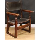 An Italian Renaissance Revival fruitwood and leather open armchair, studded back and seat tooled