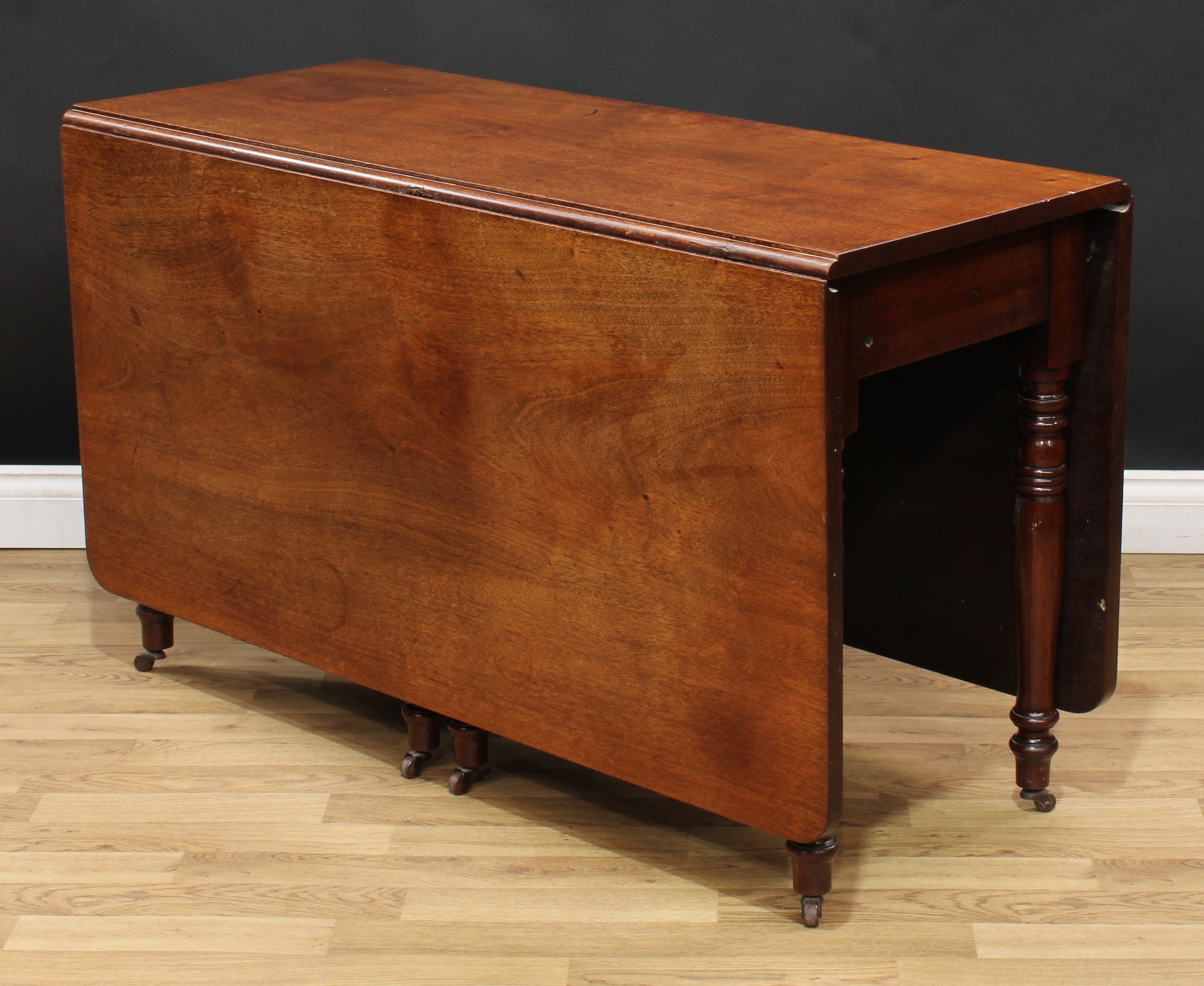 A 19th century mahogany gateleg dining table, rectangular top with fall leaves, ring-turned legs, - Image 3 of 4