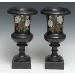 A pair of Derbyshire Ashford Marble pedestal campana shaped urns, inlaid with white roses, 26cm