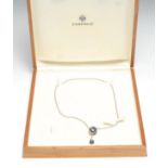 A Faberge limited edition 18ct white gold adjustable 'egg' shaped pendant necklace and dropper,