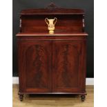 A Victorian mahogany chiffonier, the superstructure crested by carved and applied scrolls and
