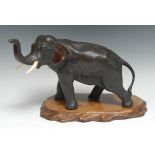 Japanese School (Meiji Period), a dark patinated bronze, of an elephant, trunk raised, 17cm high,