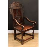 An 18th century Yorkshire oak Wainscot chair, of typical form, shaped cresting rail carved with