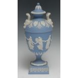 A Wedgwood Jasperware pedestal ovoid vase, typically sprigged in white with neo-classical figures
