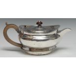 A Regency silver lamp shaped teapot and circular stand, flush-hinged domed cover, egg-and-dart