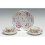 A pair of Worcester teabowls and saucers, painted in puce in Meissen style, with puce flowers, c.