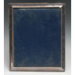 An Elizabeth II silver rectangular easel photograph frame, bead-and-reel border, 29.5cm high,