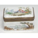 A German Rococo porcelain rounded rectangular snuff box, the hinged cover painted with lady and