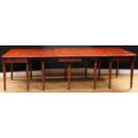 A Post-Regency William IV mahogany fourteen-leg extending dining table, comprising central gateleg