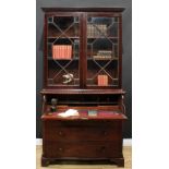 A George III mahogany secretaire bookcase, dentil cornice above a pair of astragal glazed doors