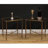 A pair of brass low sitting room tables, glass tops, X-stretchers centred by finials, 51cm high,