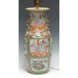 A Chinese Famille Rose ovoid vase, decorated with Oriental figures, peonies and birds, the shoulders