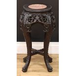 A Chinese hardwood jardiniere stand, circular beaded top with inset soapstone panel, above a