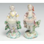 A pair of Derby Patch Mark figures, Dessert Gardeners, modelled as a boy and girl holding baskets,