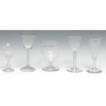 An English wine glass, bucket shaped bowl, the clear wrythen stem, folded spreading circular foot,