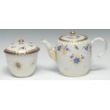 A Caughley fluted barrel shaped teapot and cover, painted with dry blue flowers, 12.5cm high, c.