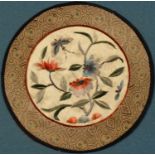 A Chinese circular silk panel, embroidered with flowers and butterfly, geometrical border, 20cm